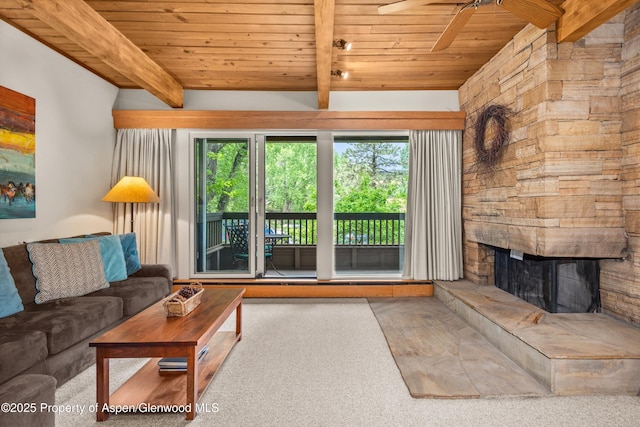 610 S W End St Unit J204, Aspen, CO 81611 - living area featuring wood ceiling with exposed beams, healthy amount of natural light, ceiling fan, carpet, and a stone fireplace