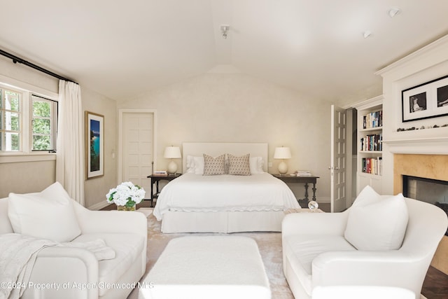 bedroom featuring lofted ceiling