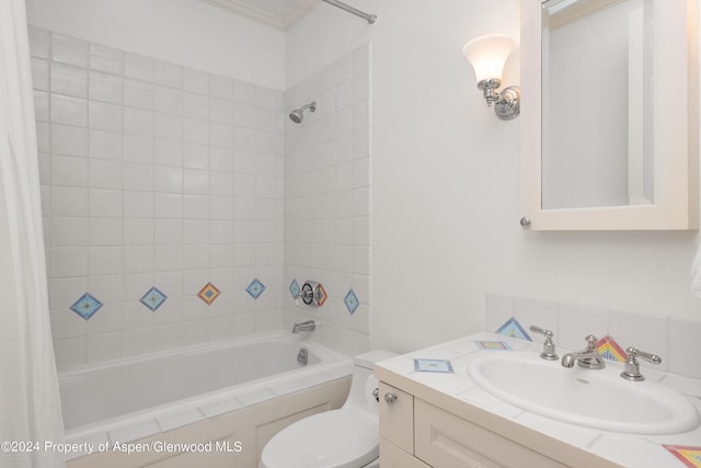 full bathroom featuring tasteful backsplash, vanity, shower / bathtub combination with curtain, and toilet