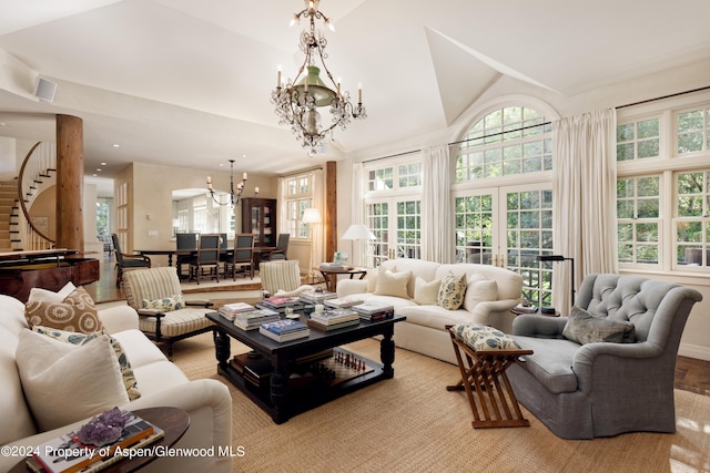 living room featuring a notable chandelier and french doors