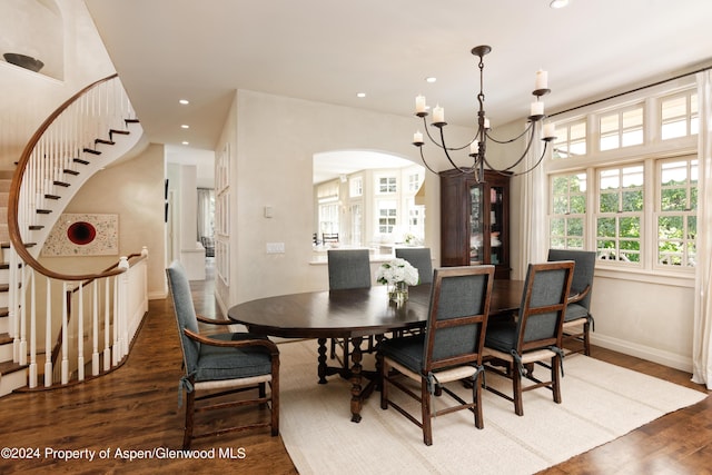 dining room with a chandelier and dark wood-type flooring