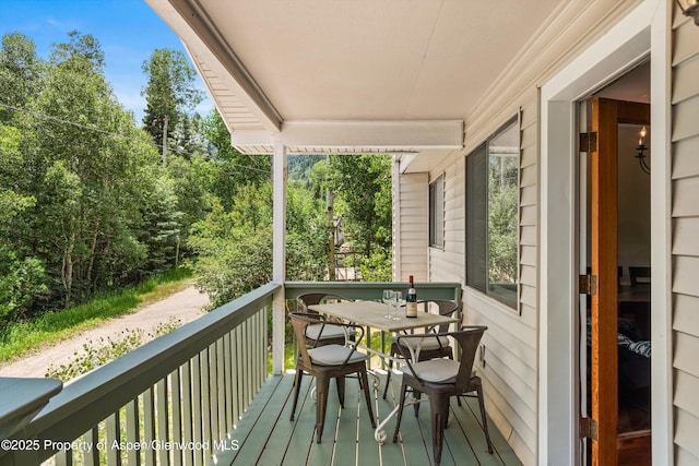 131 Aspen St, Redstone, CO 81623 - wooden deck with view of scattered trees