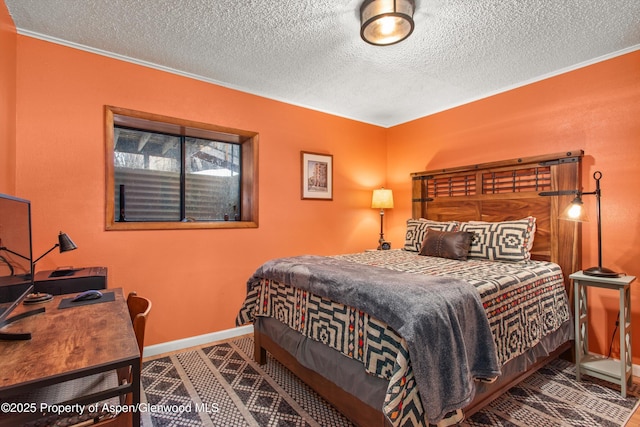 131 Aspen St, Redstone, CO 81623 - bedroom with a textured ceiling and crown molding