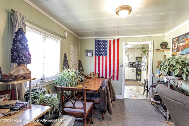 dining room featuring plenty of natural light and ornamental molding