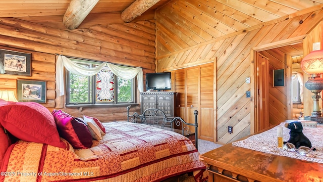 31 Ridge Dr, Craig, CO 81625 - carpeted bedroom featuring wooden ceiling and rustic walls