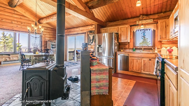 31 Ridge Dr, Craig, CO 81625 - kitchen with appliances with stainless steel finishes, wood ceiling with exposed beams, a sink, a baseboard heating unit, and a chandelier