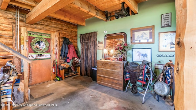 31 Ridge Dr, Craig, CO 81625 - misc room featuring concrete flooring, log walls, and wooden ceiling with exposed beams