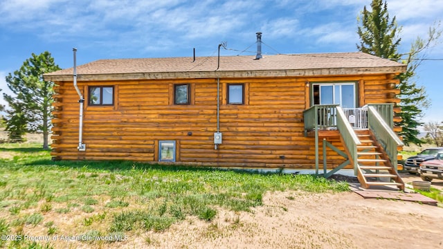 31 Ridge Dr, Craig, CO 81625 - back of property featuring log siding and a shingled roof
