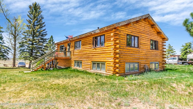 31 Ridge Dr, Craig, CO 81625 - back of house featuring log exterior, a yard, and stairs