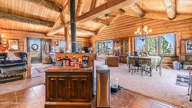 31 Ridge Dr, Craig, CO 81625 - dining area with wood ceiling, rustic walls, tile patterned floors, a chandelier, and carpet