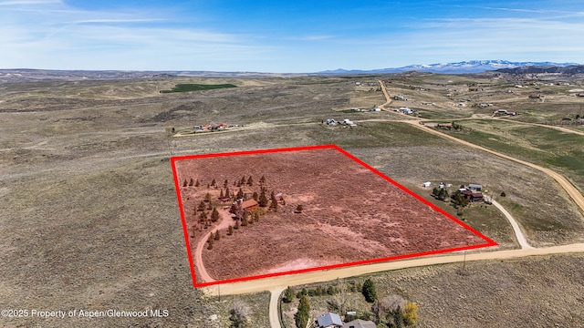 31 Ridge Dr, Craig, CO 81625 - overview of rural landscape featuring property boundaries highlighted and a mountainous background