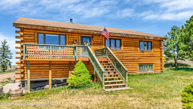 31 Ridge Dr, Craig, CO 81625 - rear view of property with log siding, stairway, a deck, and a yard