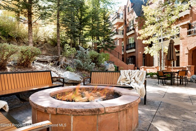 view of patio featuring a fire pit