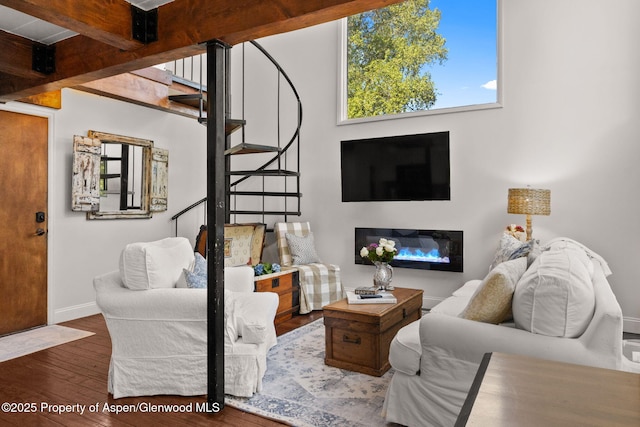 1024 E Cooper Ave Unit 8, Aspen, CO 81611 - living area with stairs, hardwood / wood-style flooring, and a glass covered fireplace