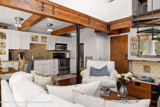 1024 E Cooper Ave Unit 8, Aspen, CO 81611 - living area featuring beam ceiling and wood finished floors
