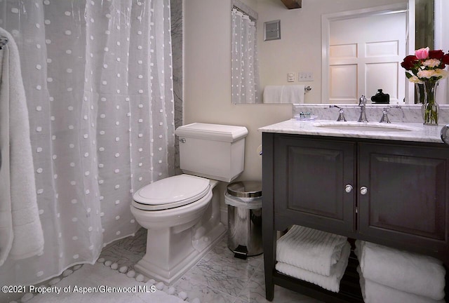 1024 E Cooper Ave Unit 8, Aspen, CO 81611 - bathroom featuring marble look tiles, vanity, and a shower with curtain