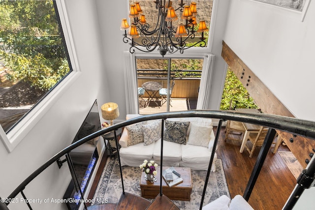 1024 E Cooper Ave Unit 8, Aspen, CO 81611 - staircase with wood-type flooring, a chandelier, plenty of natural light, and a high ceiling
