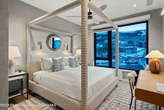 bedroom featuring hardwood / wood-style flooring and ceiling fan