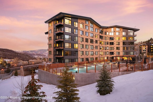 119 Wood Rd Unit 601, Snowmass Village, CO 81615 - snow covered building with a community pool