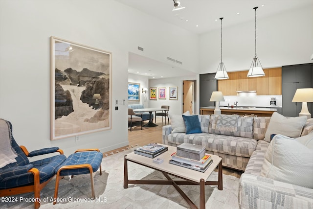 living room featuring a high ceiling