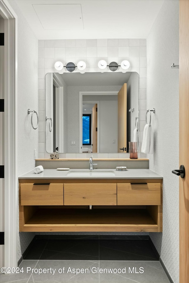 bathroom with tile patterned flooring and vanity