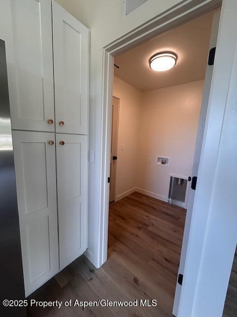 326 W 30th St, Rifle, CO 81650 - corridor featuring dark wood-style flooring and baseboards