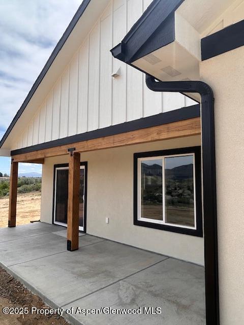 326 W 30th St, Rifle, CO 81650 - view of side of home featuring a patio area and stucco siding
