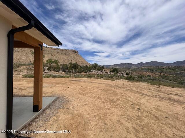 326 W 30th St, Rifle, CO 81650 - view of yard featuring a mountain view and a patio area