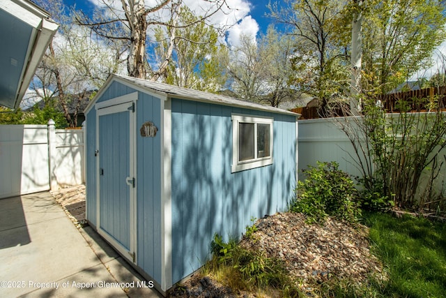 view of shed with a fenced backyard