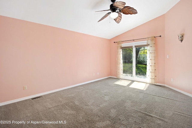 carpeted empty room with a ceiling fan, lofted ceiling, and baseboards