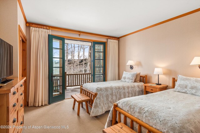 carpeted bedroom with crown molding