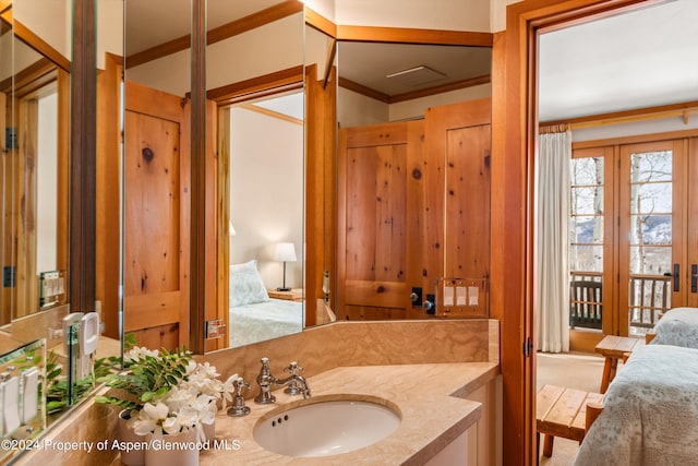 bathroom with vanity and crown molding