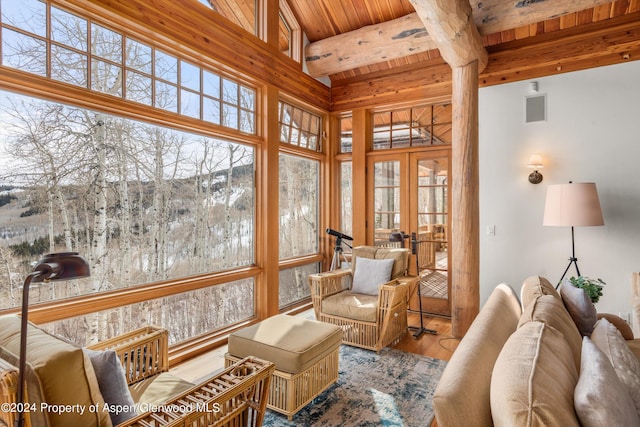 sunroom featuring french doors, beamed ceiling, and wooden ceiling