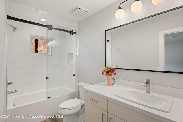 full bathroom with vanity, toilet, and enclosed tub / shower combo