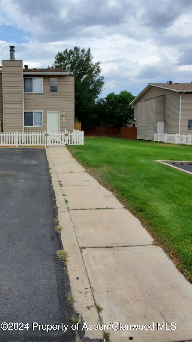 view of home's exterior with a lawn