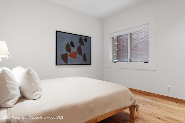 bedroom featuring wood-type flooring