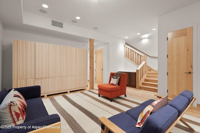 living room with light hardwood / wood-style floors