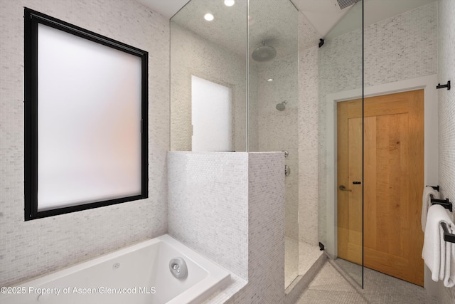 bathroom with independent shower and bath