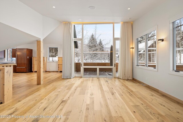 unfurnished living room with light wood-type flooring