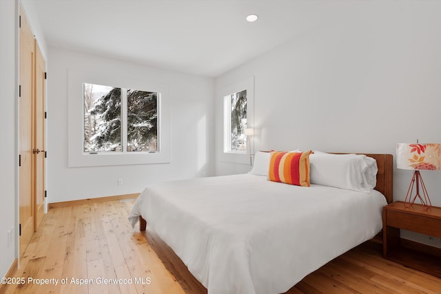 bedroom with light wood-type flooring