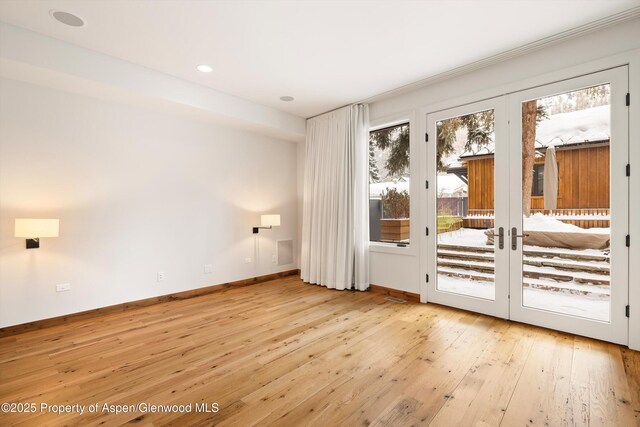 doorway to outside with light hardwood / wood-style flooring and french doors