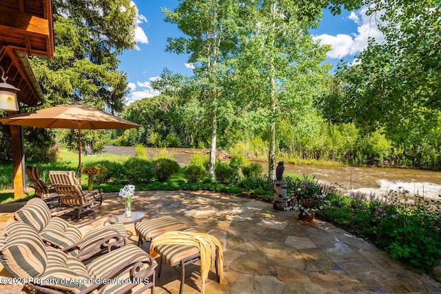 view of patio featuring a water view