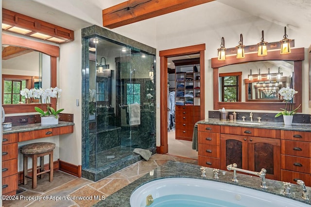 bathroom featuring shower with separate bathtub and vanity