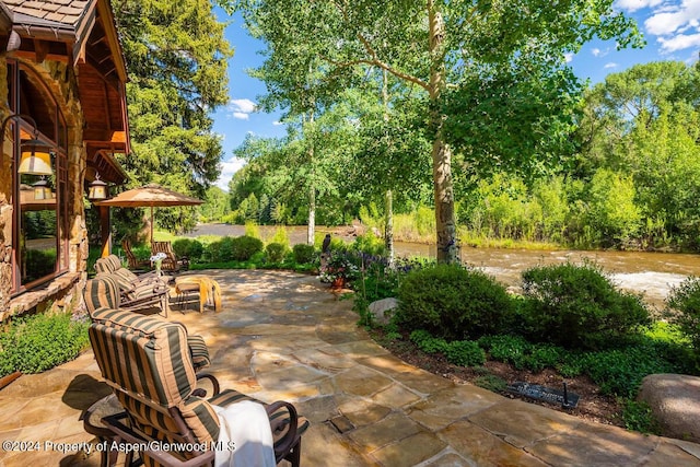 view of patio / terrace with a water view