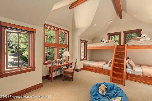 bedroom with lofted ceiling with beams and light carpet