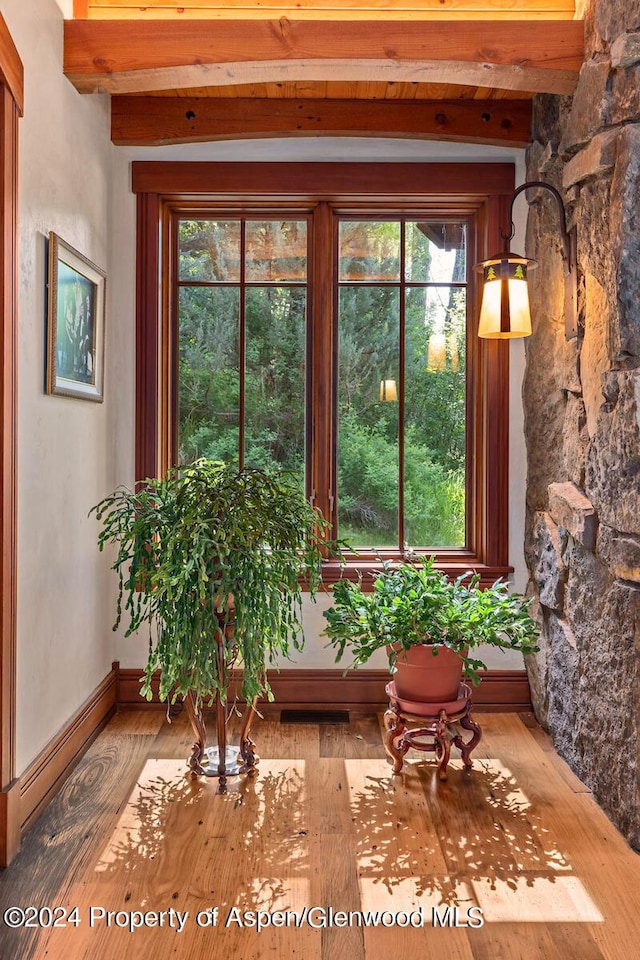 sunroom / solarium with beam ceiling