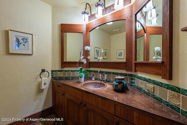 bathroom with decorative backsplash and vanity