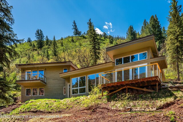 768 Kings Lake Rd, Basalt, CO 81621 - back of property featuring a balcony and a view of trees