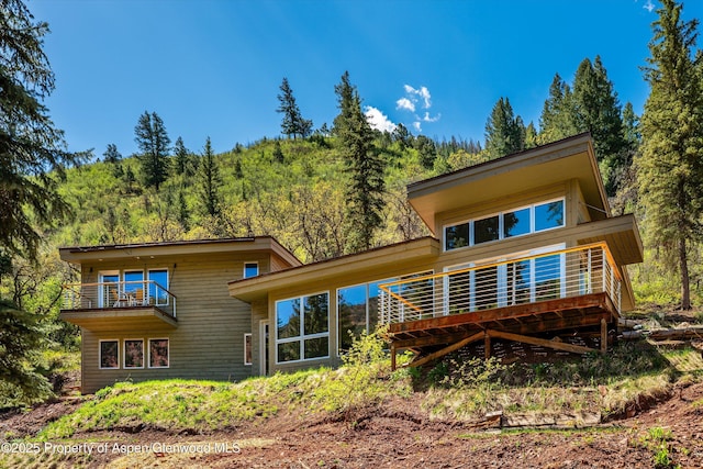 768 Kings Lake Rd, Basalt, CO 81621 - back of property featuring a balcony and a view of trees