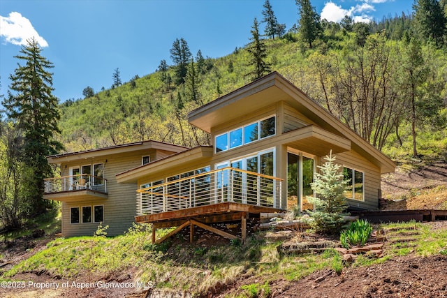 768 Kings Lake Rd, Basalt, CO 81621 - back of property featuring a forest view and a wooden deck